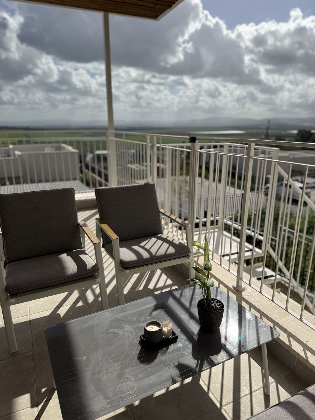 Seating area on the large balcony facing the Jezreel Valley fields