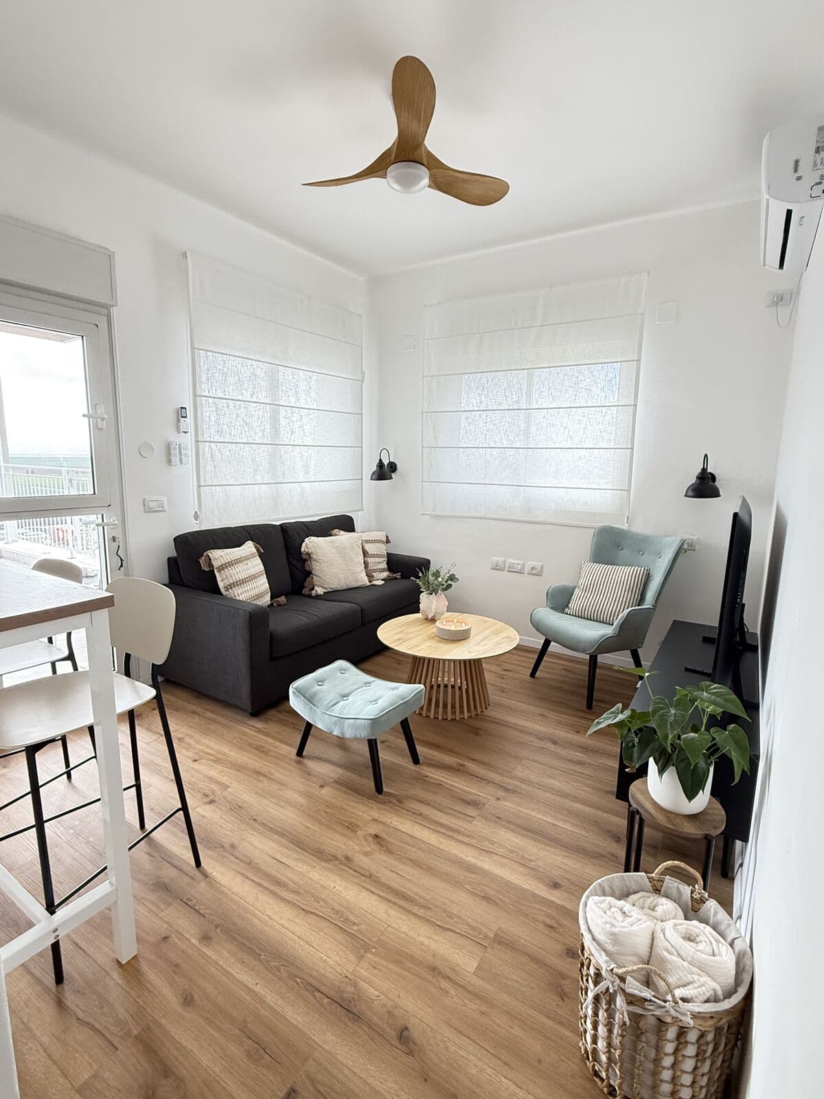 The studio living room features a sofa bed and seating area
